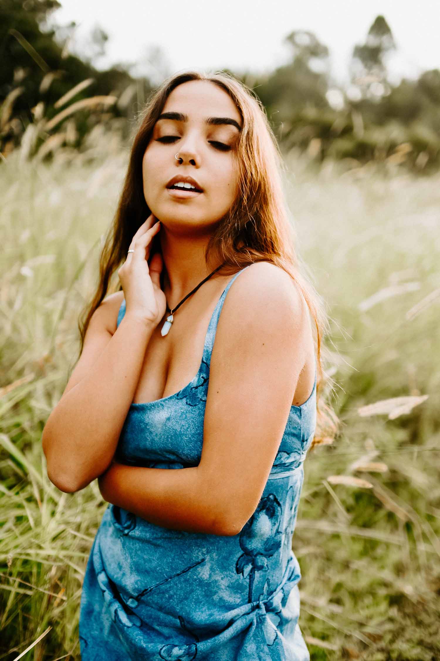 Noff Baras in a field with blue dress